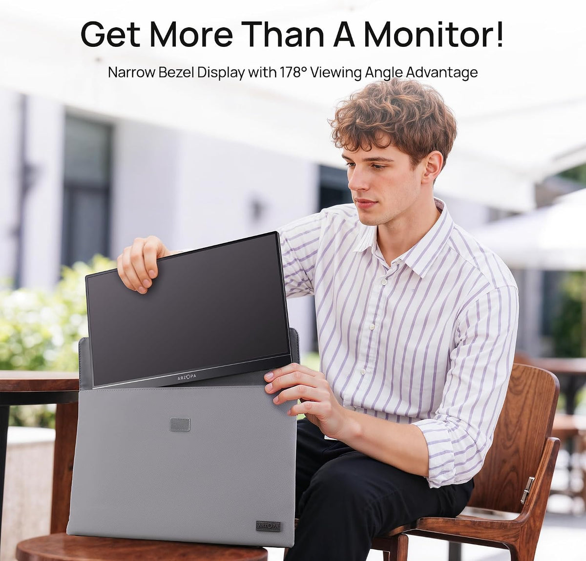 A man packing the black ARZOPA Z1C portable monitor into a protective smart cover sleeve case for business travel.